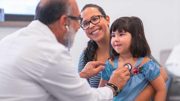 Doctor with mother and daughter