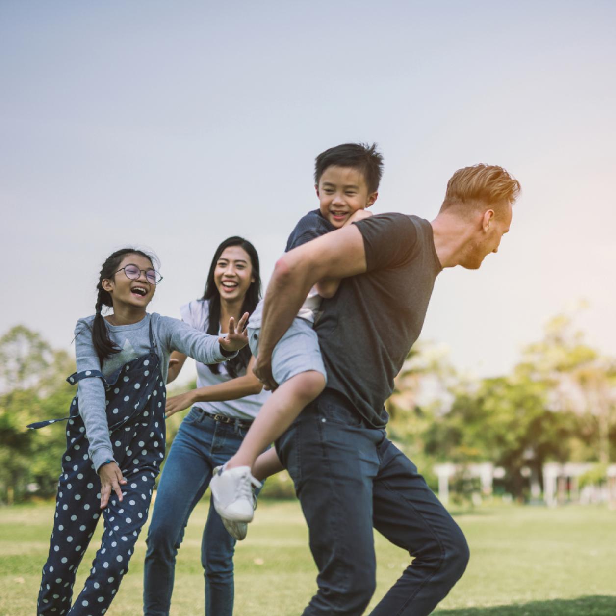 Family playing in their yard